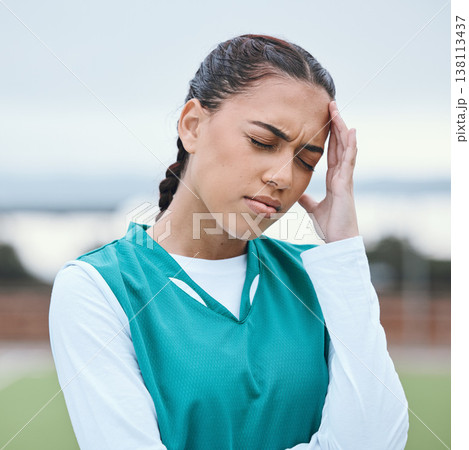 Sports, headache or face of girl on hockey field for fitness, exercise game or workout emergency. Tired woman, stress anxiety or sick athlete with migraine, injury or head pain frustrated by training Sports, headache or face of girl on hockey field for fitness, exercise game or workout emergency. Tired woman, stress anxiety or sick athlete with migraine, injury or head pain frustrated by training 138113437