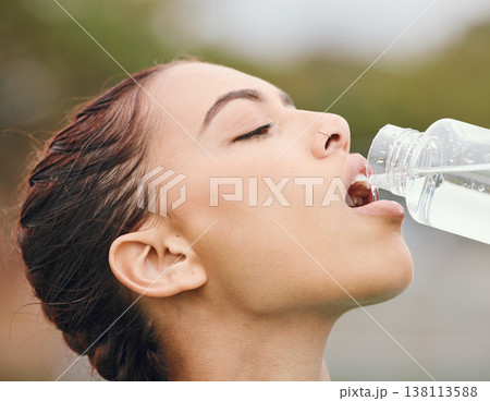 Outdoor, wellness and woman drinking water, fitness and tired with fatigue, nutrition and workout. Person, runner and athlete with hydration, liquid or thirsty with health, bottle with aqua or sports 138113588