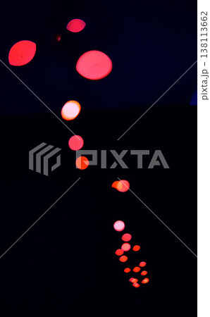 Bokeh, red lamp lights on black background with pattern, texture and dots mockup with cosmic aesthetic. Night lighting, sparkle particles and glow on dark wallpaper with space, color shine and flare. Bokeh, red lamp lights on black background with pattern, texture and dots mockup with cosmic aesthetic. Night lighting, sparkle particles and glow on dark wallpaper with space, color shine and flare. 138113662