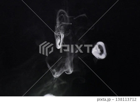 Smoke, fog and air puff on dark background, vapor wave with cloud of gas and fantasy in a studio. Texture, steam or spray with mystery, incense or mist, dry ice with special effects and moving smog 138113712