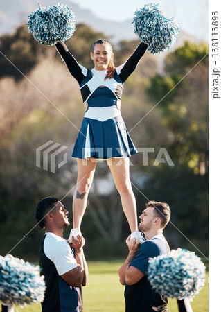 Cheerleader, sports and men balance woman on field for performance, dance and game motivation. Teamwork, dancer and people in costume cheer for support in match, competition and event outdoors Cheerleader, sports and men balance woman on field for performance, dance and game motivation. Teamwork, dancer and people in costume cheer for support in match, competition and event outdoors 138113893