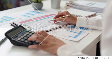 Accountant analyzing spreadsheets and financial data Accountant analyzing spreadsheets and financial data 138115294