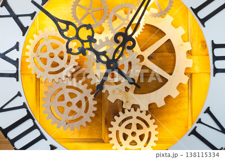 Huge fairy like clock with watch mechanism. Magical golden clock dial closeup 138115334