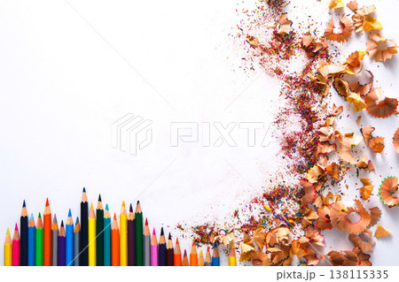 Drawing tools background. Lot of colorful pencils frame with sawdust and shavings on white, copy space, flat lay Drawing tools background. Lot of colorful pencils frame with sawdust and shavings on white, copy space, flat lay 138115335