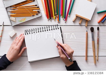 Draw in sketchbook. Creative artist workspace top view. Background of painting, art stationery 138115384