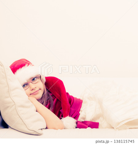 Cute little lady crawling on sofa. 138115745