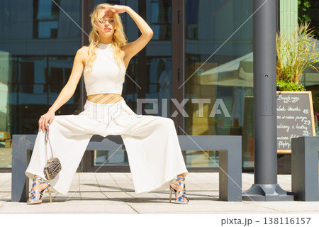 Woman wearing crop top and culottes Woman wearing crop top and culottes 138116157