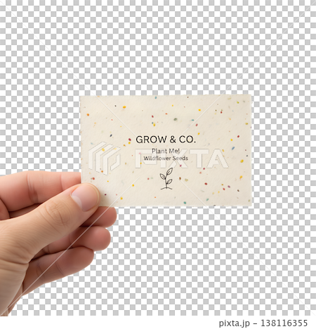 Hand holding a plantable business card embedded with wildflower seeds, representing sustainable marketing, eco-friendly branding, and green business Hand holding a plantable business card embedded with wildflower seeds, representing sustainable marketing, eco-friendly branding, and green business 138116355