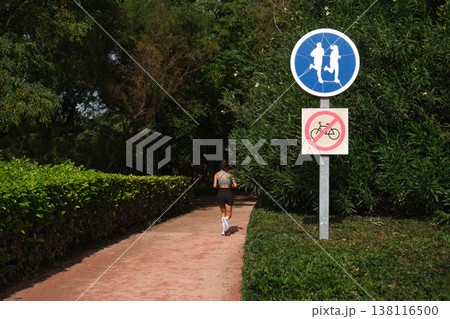 road signs bicycles prohibited and a treadmill in the park road signs bicycles prohibited and a treadmill in the park 138116500