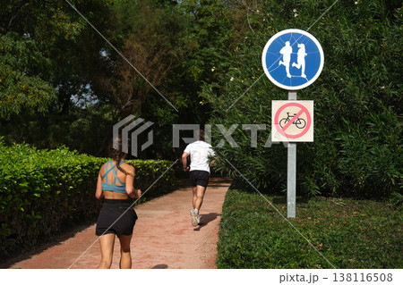 road signs bicycles prohibited and a treadmill in the park road signs bicycles prohibited and a treadmill in the park 138116508