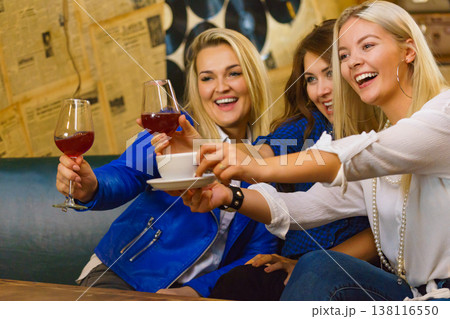 Happy girls in pub club having fun Happy girls in pub club having fun 138116550