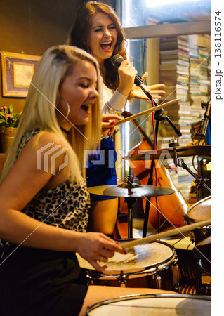 Woman singing, band playing instruments. 138116574