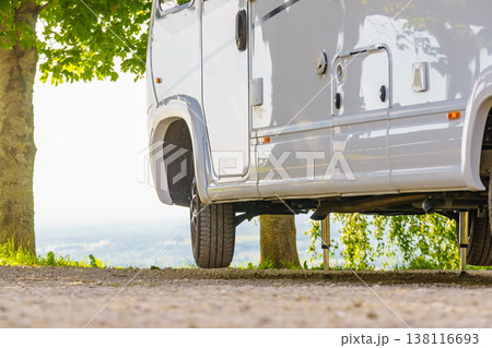 Camper with hydraulic leg in use. Rv levelling system 138116693