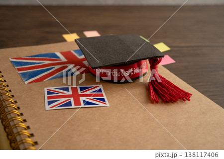 UK flag with graduate hat on english language book. 138117406