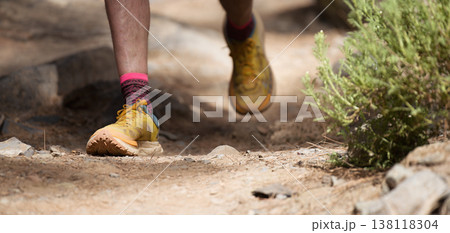 Walking or running exercise legs on rocky footpath in bright forest achievement fitness adventure and exercising in spring or summer nature motivation and inspirational activity 138118304