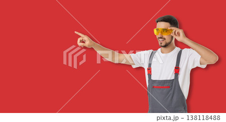 Occupation, Young man gestures with sunglasses and work clothes 138118488