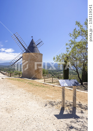 Historic windmill standing on a hilltop in Provence 138119141