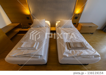 Modern hotel room with two single beds Modern hotel room with two single beds 138119154
