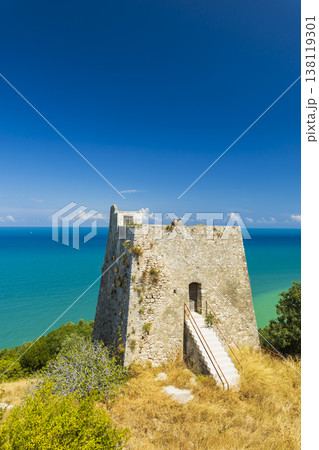 Old Peschici watchtower on Gargano coast overlooking sea Old Peschici watchtower on Gargano coast overlooking sea 138119301