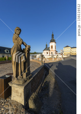 Baroque statue and Saint John the Baptist Church in Manetin Baroque statue and Saint John the Baptist Church in Manetin 138119312