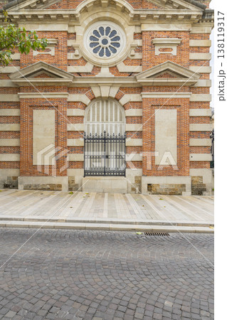 Epernay building facade with round window and old cobblestone street 138119317
