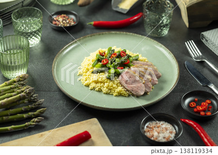 Sliced duck breast with millet asparagus chili Sliced duck breast with millet asparagus chili 138119334