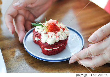 red velvet cake with strawberry topping or a piece of cake or small cake 138120063