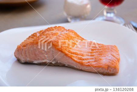 Large Fried Salmon Fillet on White Plate Large Fried Salmon Fillet on White Plate 138120208