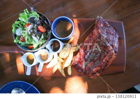 pork rib or pork steak , barbecue pork rib with french fries pork rib or pork steak , barbecue pork rib with french fries 138120911