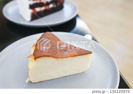 cheesecake or basque cheesecake , piece of cake 138120978