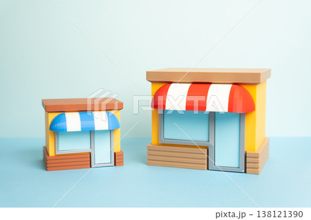 One store is larger than another showing business competition. Comparing franchises and growth. Market rivalry, performance differences, expansion strategies influence success, competitive positioning One store is larger than another showing business competition. Comparing franchises and growth. Market rivalry, performance differences, expansion strategies influence success, competitive positioning 138121390