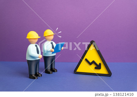 Engineers studying a performance decline. Declining performance, problems, and solutions. Technical analysis identifies issues. Optimization strategies improve efficiency and restore Engineers studying a performance decline. Declining performance, problems, and solutions. Technical analysis identifies issues. Optimization strategies improve efficiency and restore 138121410