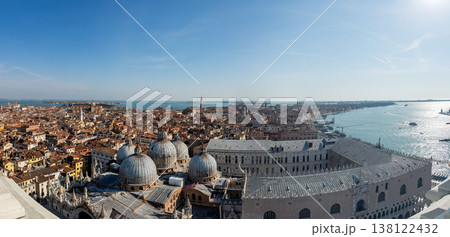 Aerial panorama of Venice rooftops and shimmering lagoon 138122432