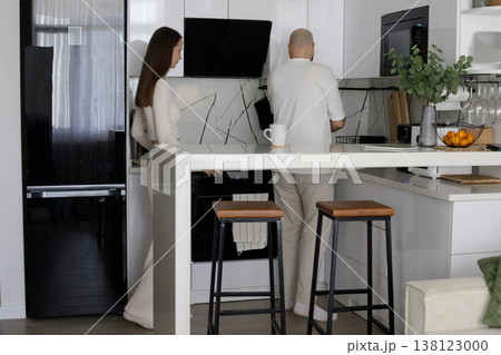 Young woman and man together. Couple in kitchen in home for morning. 138123000