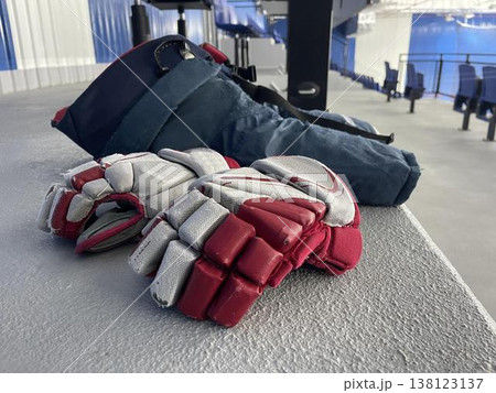 hockey gloves and pants on the floorin stadium before game 138123137