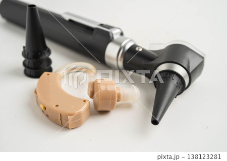 Otoscope isolated on white background for otolaryngologist or ENT physician doctor examining senior patient ear, hearing loss problem. 138123281