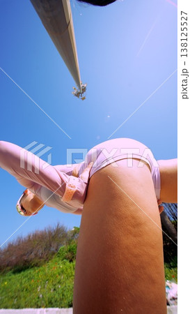 Bright outdoor setting showcasing woman in motion with lively energy Bright outdoor setting showcasing woman in motion with lively energy 138125527
