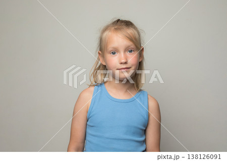 Cute blond child looking at camera on white background Cute blond child looking at camera on white background 138126091