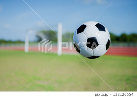 Footballs on the field and goal nets in a large stadium Footballs on the field and goal nets in a large stadium 138126554