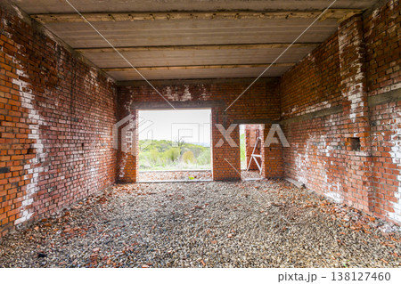 Interior of an old building under construction. Orange brick walls in a new house. 138127460