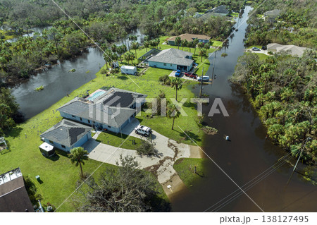 Heavy flood with high water surrounding residential houses after hurricane Ian rainfall in Florida residential area. Consequences of natural disaster 138127495