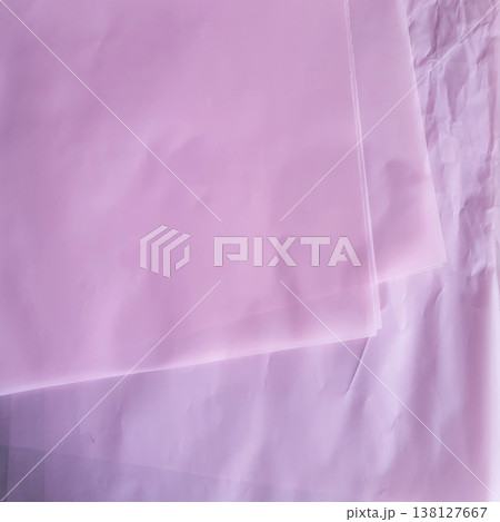 Delicate texture of light pink paper in silence with light folds. Translucent background for design, gift wrapping Delicate texture of light pink paper in silence with light folds. Translucent background for design, gift wrapping 138127667