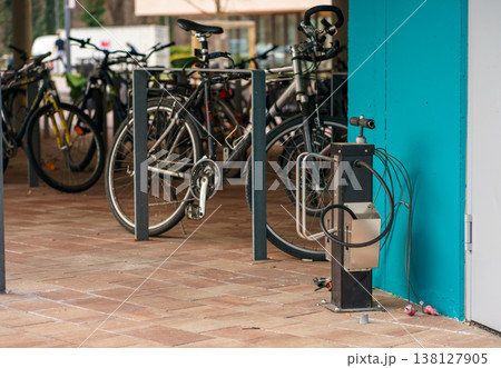 Bicycles parked in city with repair station, sustainable transport, eco mobility, urban lifestyle, cycling infrastructure and modern commuting Bicycles parked in city with repair station, sustainable transport, eco mobility, urban lifestyle, cycling infrastructure and modern commuting 138127905