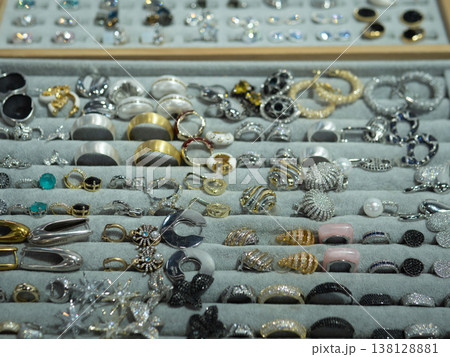 Neatly Arranged Ring Selection In Tray With Rows Of Bands And Gemstone Solitaires, Velvet Compartments, Inventoryready Layout For Retail And Wholesale, Catalog Photography Feel 138128881