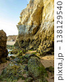 Colorful cliffs majestic rock formations on Algarve Portugal beach Praia do Amado 138129540