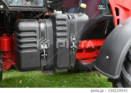 Tractor fuel tank details on a farm machine Tractor fuel tank details on a farm machine 138129541