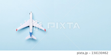 Toy passenger airplane on blue background Toy passenger airplane on blue background 138130462