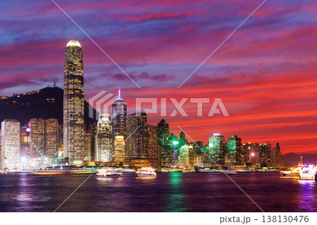 Hong Kong city skyline at sunset with glowing sky and skyscrapers Hong Kong city skyline at sunset with glowing sky and skyscrapers 138130476