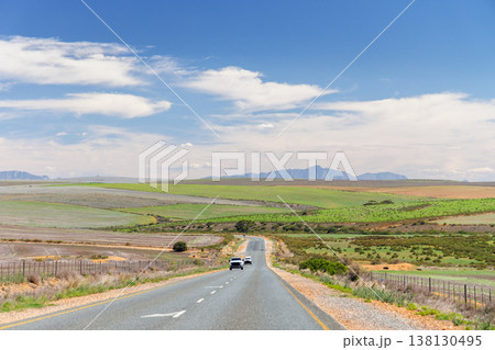 Asphalt road in South Africa surrounded by fields Asphalt road in South Africa surrounded by fields 138130495