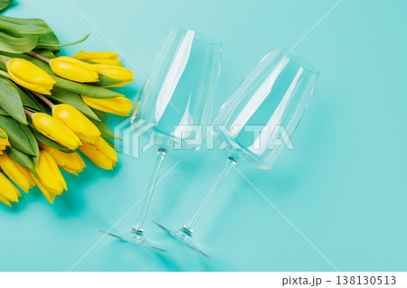 White wine glasses with yellow tulips 138130513